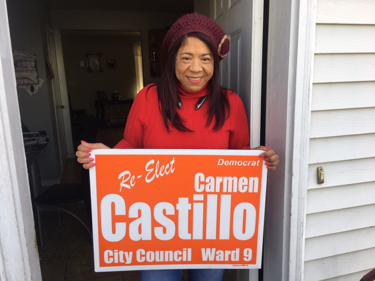 Providence City Councilwoman Carmen Castillo displays a campaign sign.