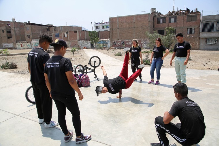 Image: Karin Rojas practices with other break dancers in Lima, Peru, on Dec. 10, 2018.