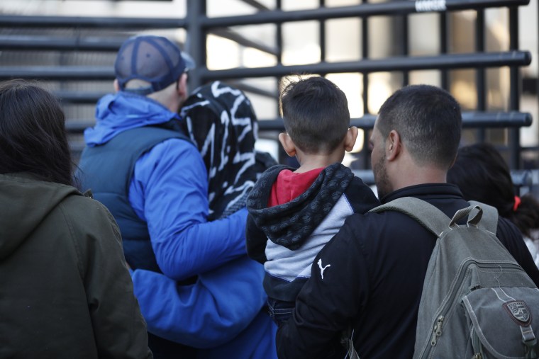 Image: Honduran asylum seekers enter the United States at the Otay Mesa port of entry on Dec. 18, 2018.