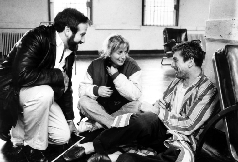 Image: Director Penny Marshall on the set of "Awakenings" with Robin Williams and Robert De Niro in 1990.