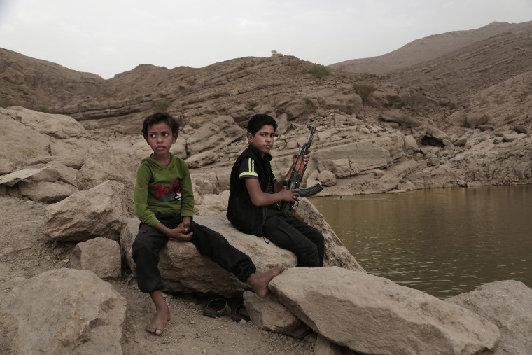 A 17-year-old boy holds his weapon in Marib, Yemen.