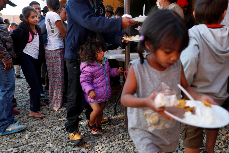 Image: Migrants at their camp near the U.S. border in Tijuana, Mexico