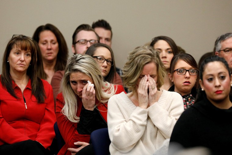 Image: Victims and supporters look on as Rachael Denhollander speaks at the sentencing hearing for Larry Nassar in Lansing, Michigan, on Jan. 24, 2018.
