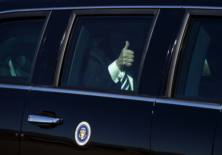 Image: President Donald Trump gives the thumbs-up before boarding Air Force One in Nevada on Oct. 20, 2018.