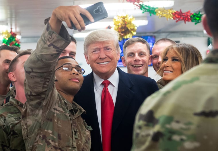 Image: President Donald Trump and First Lady Melania Trump greet members of the U.S. military during an unannounced trip to Al Asad Air Base in Iraq on Dec. 26.