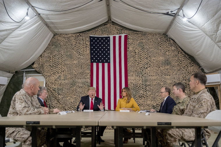 Image: President Donald Trump and Melania Trump meet with National Security Adviser John Bolton, U.S. Ambassador to Iraq Doug Silliman, and military leadership at Al Asad Air Base.