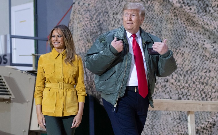 Image: President Donald Trump and First Lady Melania Trump arrive to speak to troops at Al Asad Air Base.