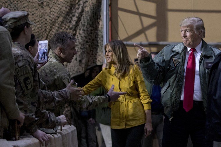 Image: President Donald Trump and first lady Melania Trump greet troops at a hanger rally at Al Asad Air Base in Iraq.