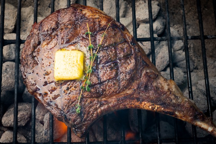 Image: Rib Eye Beef Steak with Melted Butter on a Grill