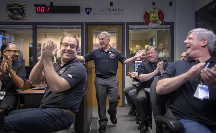 Image: New Horizons principal investigator Alan Stern celebrates with team members after receiving signals from the New Horizons spacecraft during the flyby of Ultima Thule at the Mission Operations Center in Laurel, Maryland,  on Jan. 1, 2019.