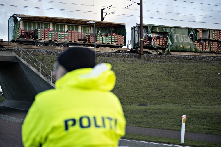 Image: Damaged cargo compartments of a train after crash in Denmark