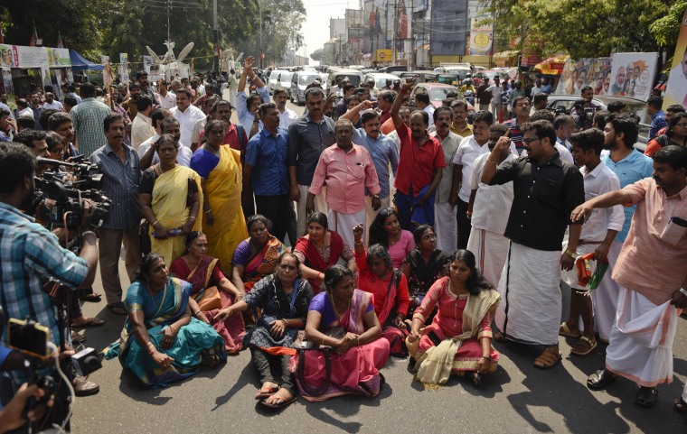 Image: Demonstrators block traffic while protesting reports that two women entered the Sabarimala Temple in Kerala, India, on Jan. 2, 2019.