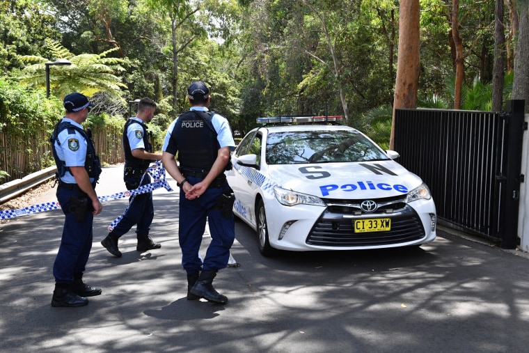 Image: New South Wales police stand guard at the scene of a stabbing at the Church of Scientology headquarters in Chatswood, Australia, on Jan. 3, 2019.