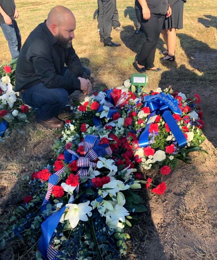 Image: Robert Mosqueda kneels at the grave of his father Carlos Mosqueda, a Vietnam veteran deported from the United States.