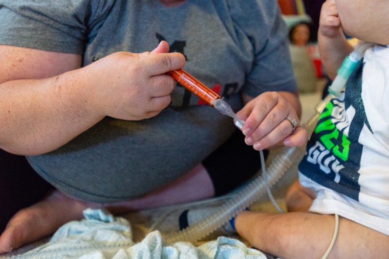 Anderson Moreno needs about two dozen different medicines every 24 hours, says his mother, Alicia. She administers them via a port in his belly at designated times.