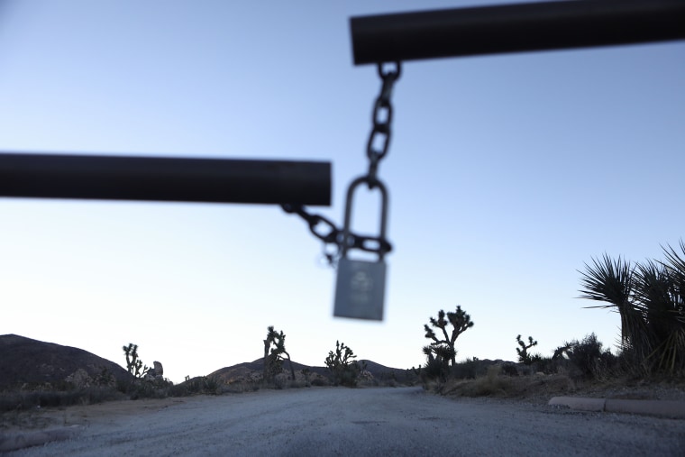 Image: The entrance gate to a campground is locked at Joshua Tree National Park
