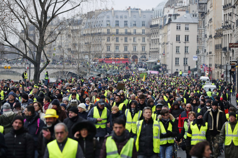 Paris, France - Circa 2019: Pedestrians walking near burned luxury