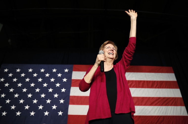 Image: Sen. Elizabeth Warren, D-Mass, waves to the crowd during an organizing event in Des Moines, Iowa