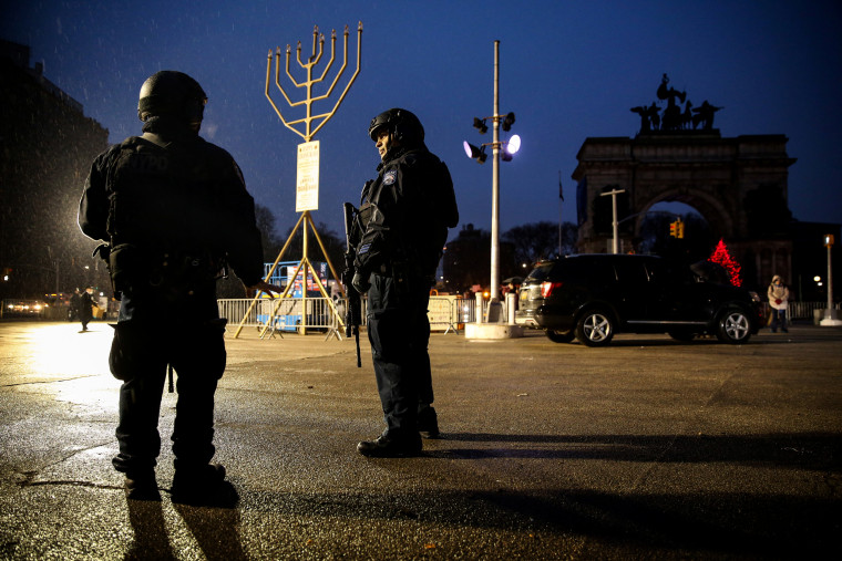 Image: Police stand at Brooklyn gathering