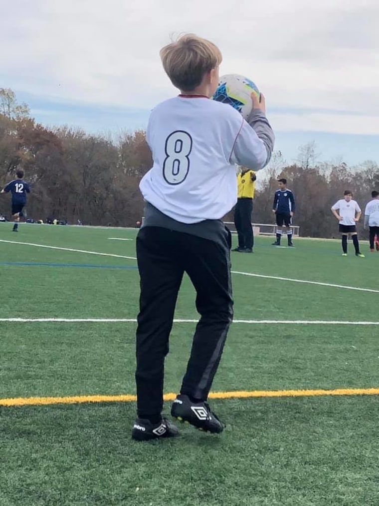 Anderson Folsom, 12, takes a throw-in during a rec soccer game.