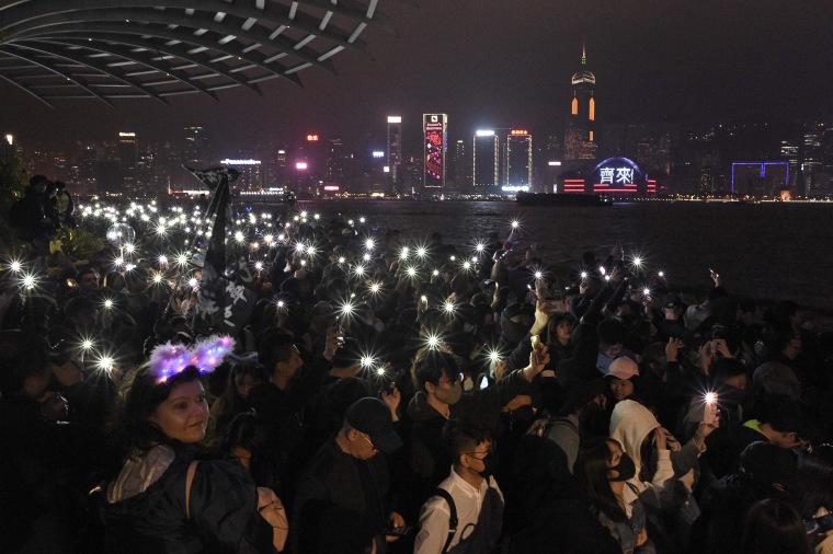 Anti-government protesters in Hong Kong held hands and formed human chains across the city as they carried their months-long movement and its demands into 2020 with midnight countdown rallies.