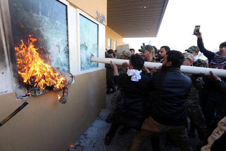 Image: Diplomatic staff evacuated as mob storms US Embassy in Baghdad