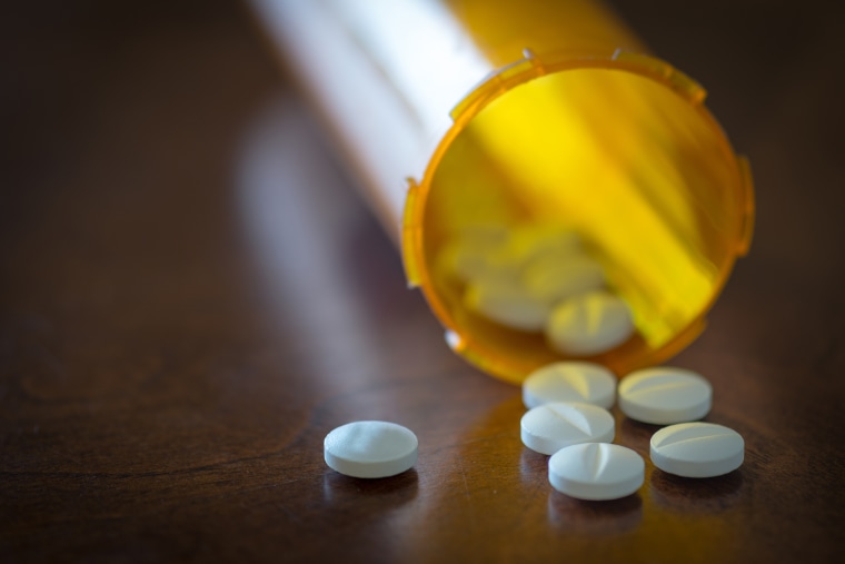 Image: Prescription pills in a yellow bottle