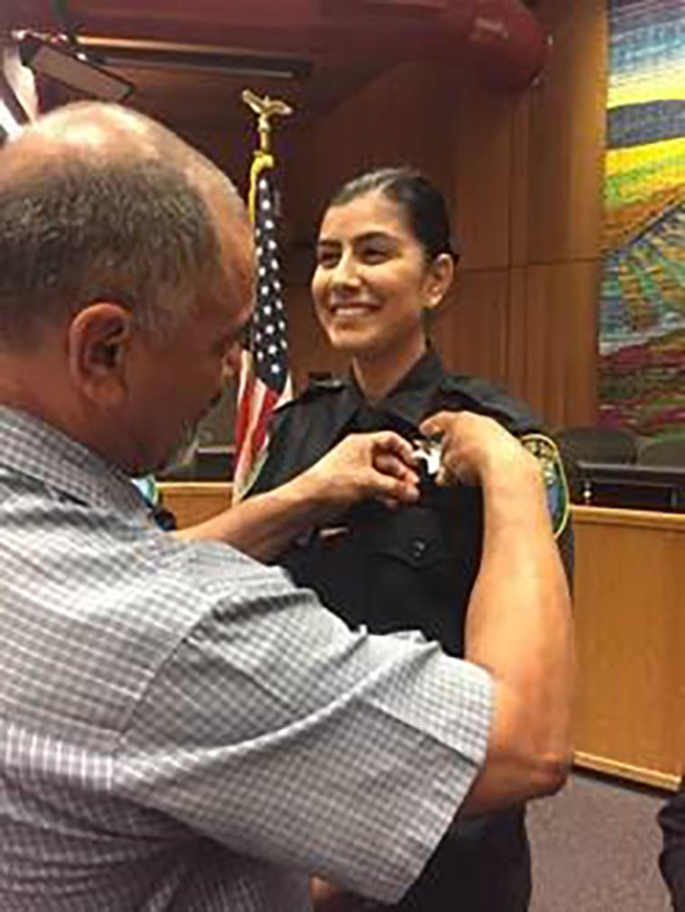 Image: Natalie Corona is sworn in the Police Department by her father, Merced