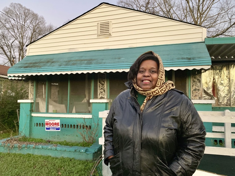 Image: Keisha Brown, 40, stands outside her home in the the Harriman Park neighborhood in Birmingham, Ala