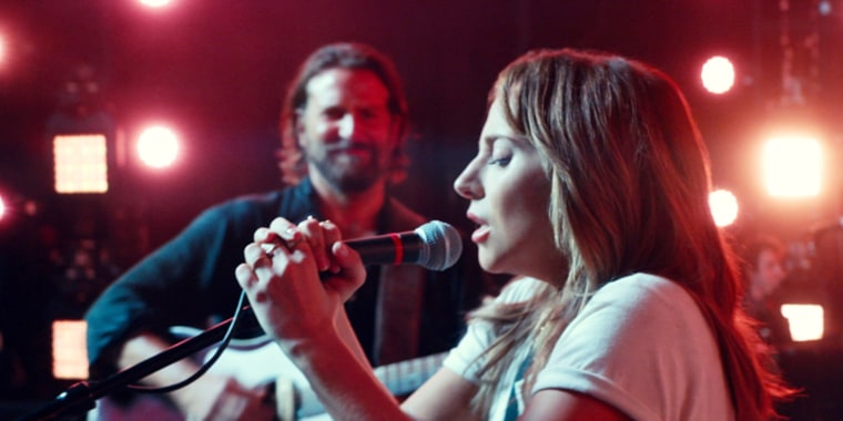 Lady Gaga sings in "A Star is Born" while Bradley Cooper watches.