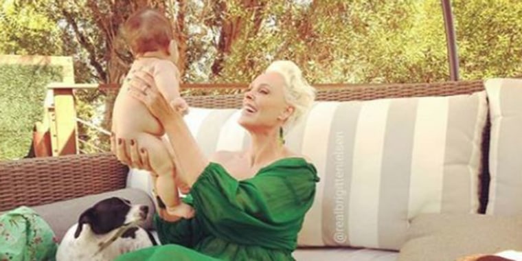 Brigitte Nielsen with her baby girl, Frida, and her rescue dog, Joker