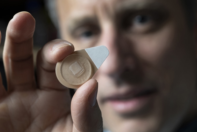 Professor Mark Prausnitz holds an experimental microneedle contraceptive skin patch