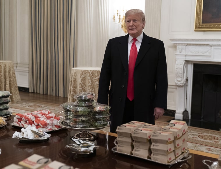 Image: United States President Donald J. Trump presents fast food to be served to the Clemson Tigers during White House visit