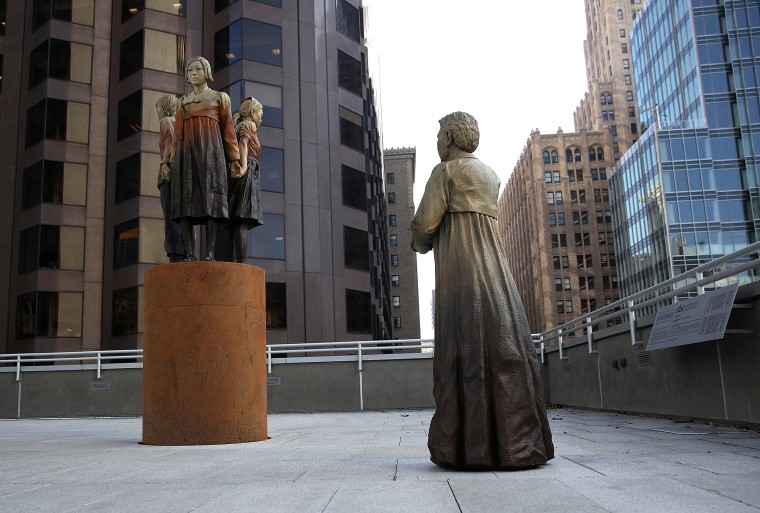 Image: \"Women's Column of Strength,\" a bronze statue by artist Steven Whyte, at St. Mary's Square in San Francisco, California, on Nov. 1, 2017.