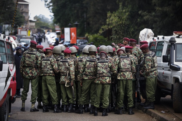 Image: Kenyan police officers prepare enter the complex in Nairobi on Tuesday