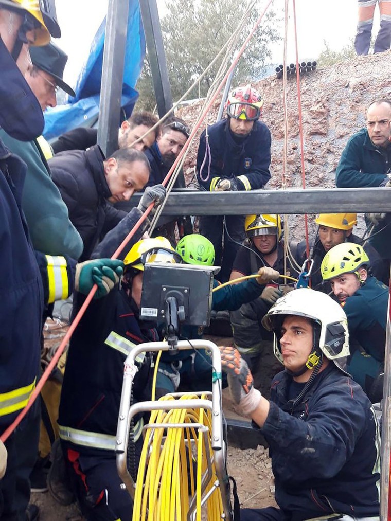 Image: Rescue teams start opening a new hole to reach where the toddler is trapped