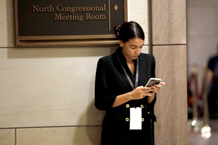 Incoming Representative Alexandria Ocasio-Cortez waits for a House of Representatives member-elect welcome briefing