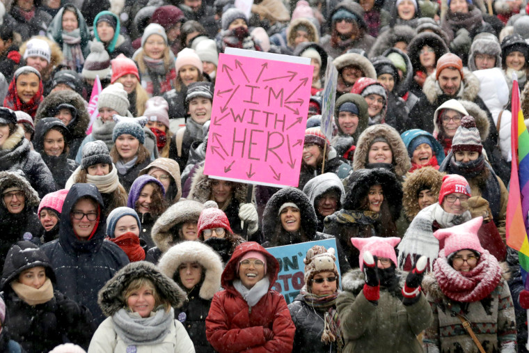 Image: Participants listen to speakers outside City Hall during the Women's March in Toronto