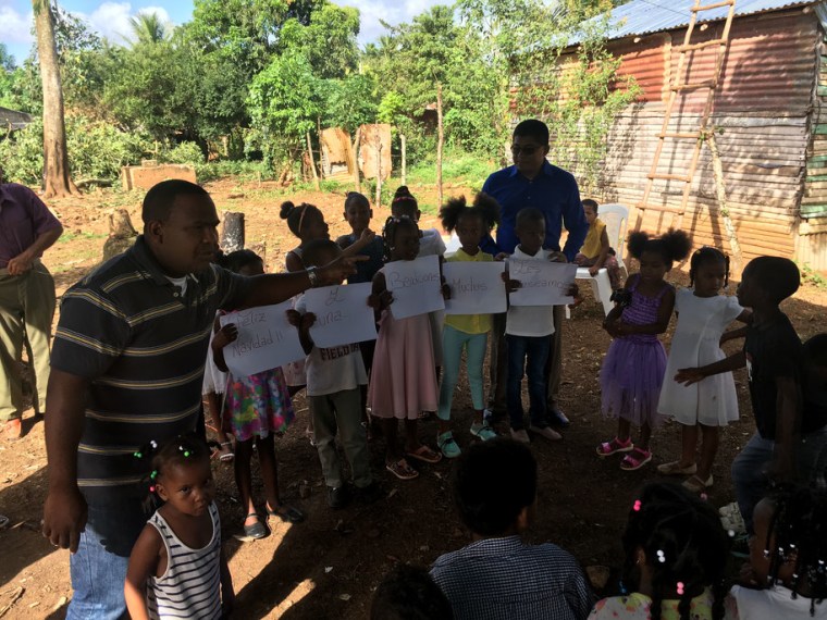 Roberto Mendoza in a village in the Dominican Republic where he helps feed and cook for the children.