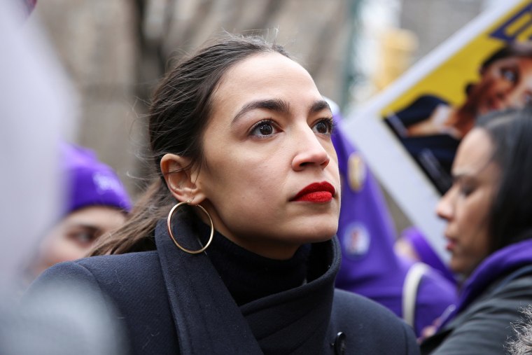Image: Rep. Alexandria Ocasio-Cortez looks on during a march organised by the Women's March Alliance in the Manhattan borough of New York City
