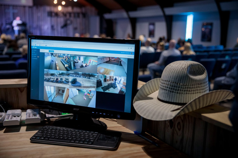 A security camera monitor is seen during a church service at Ava Assembly of God.