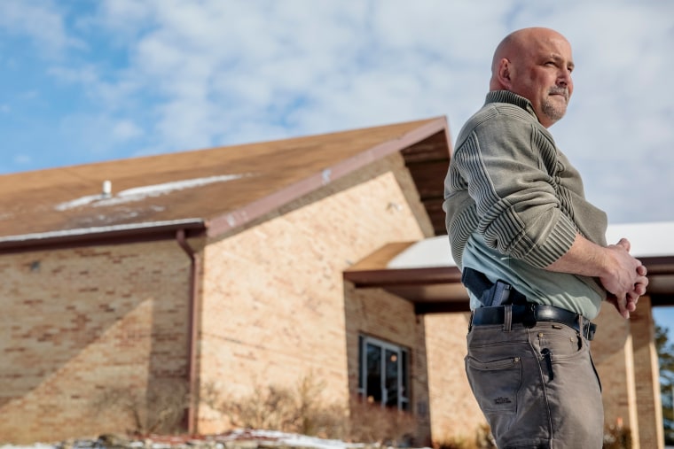 Trampus Taylor, head of the church's security team, poses for a portrait outside Ava Assembly of God on Sunday, Jan. 20 in Ava, Missouri.