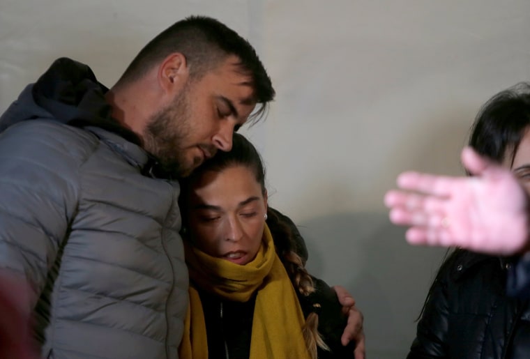 Image: Julen's parents embrace each other during a vigil as a miner rescuer team descends into a drilled well at the area where Julen, a Spanish two-year-old boy, fell into a deep well, in Totalan