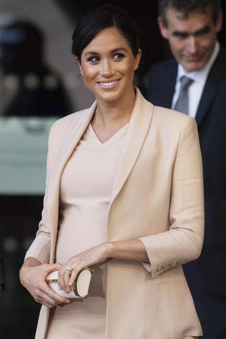 Meghan Markle Gets Blush-y as She Visits The National Theatre in