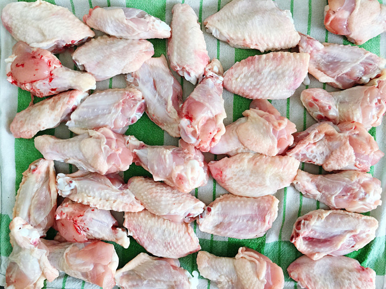 High Angle View Of Raw Chicken Wings On Table