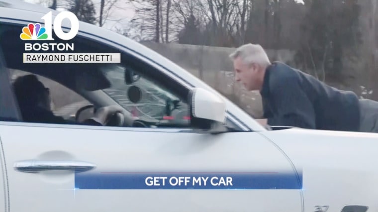 Police told NBC Boston that Richard Kamrowski, 65, jumped onto the hood of a white Infiniti SUV that belonged to Mark Fitzgerald, 37, after a verbal altercation over a minor traffic accident on Interstate 90 about 20 miles west of Boston.