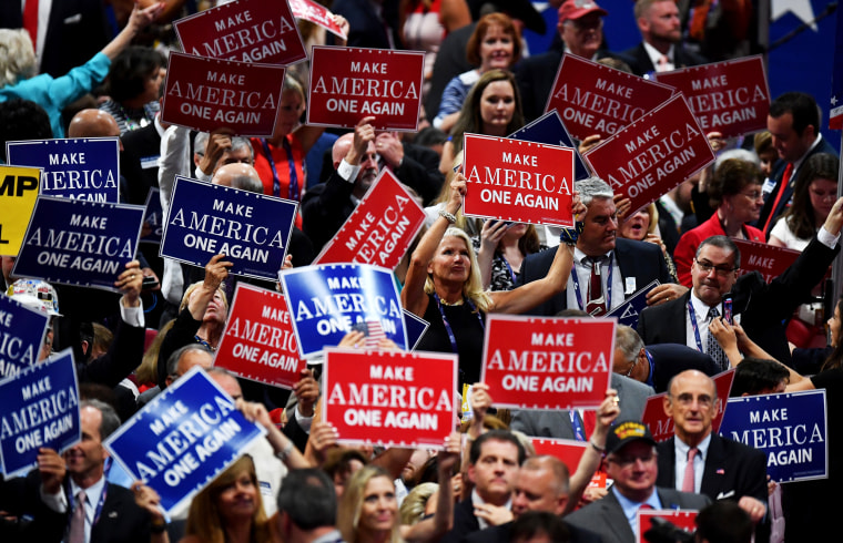 Image: Delegates hold signs at the Republican National Convention in Cleveland, Ohio, on July 21, 2016.
