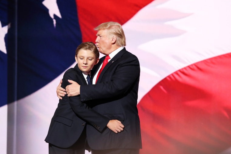 Image: Donald Trump embraces his son, Barron, at the Republican National Convention in Ohio on July 21, 2016.
