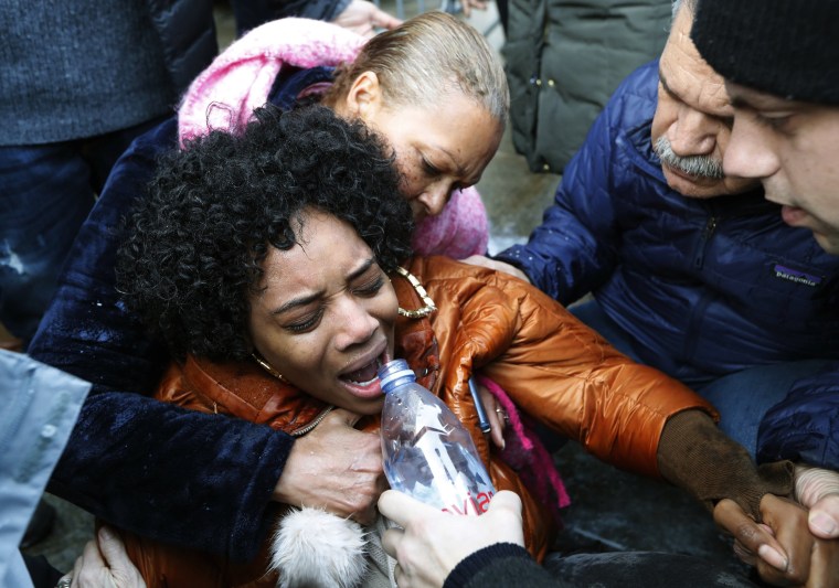 Image: A woman is helped after she was pepper sprayed at the Metropolitan Detention Center in Brooklyn on Feb. 3, 2019.