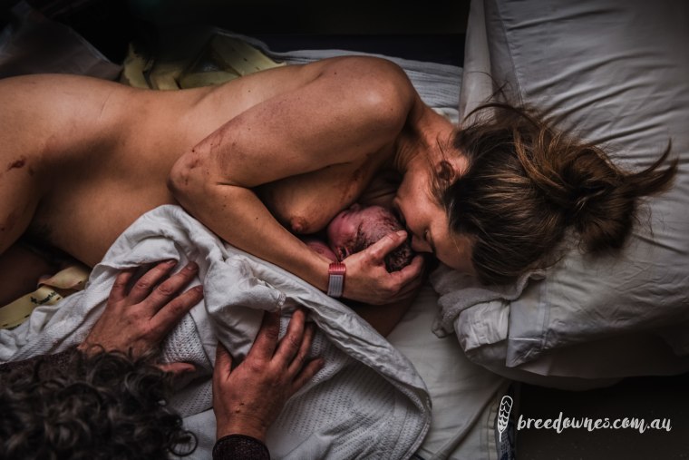 Photographer Bree Downes captured a touching moment between a mom and her newborn following her hospital delivery. Downes' picture won third place for hospital images.